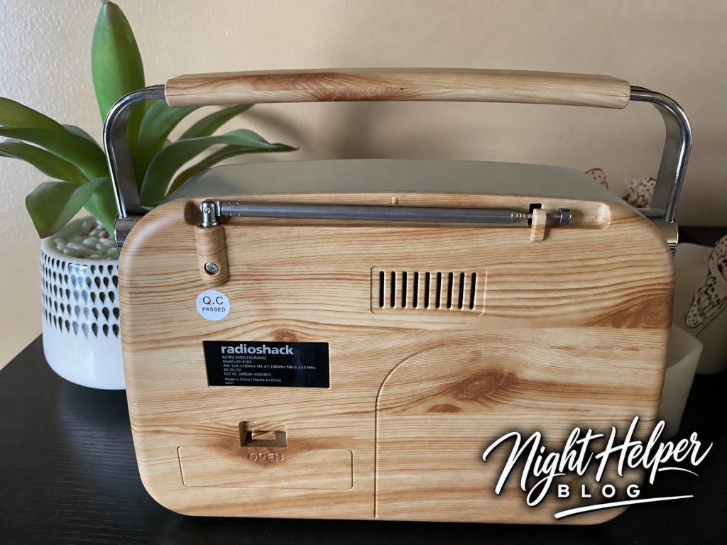 Rear view of the RadioShack retro radio with its folded antenna, carry handle, and battery compartment